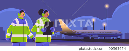 aviation marshallers supervisors near aircraft air traffic controllers airline workers in signal vests professional airport staff 90565654