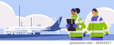 aviation marshallers supervisors near aircraft air traffic controllers airline workers in signal vests professional airport staff aviation marshallers supervisors near aircraft air traffic controllers airline workers in signal vests professional airport staff 90565657