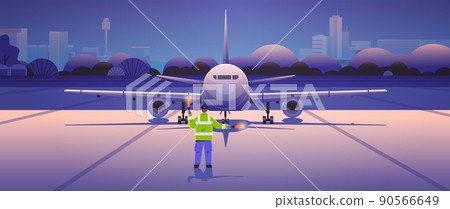 aviation marshaller signaling near aircraft air traffic controller airline worker in signal vest professional airport staff 90566649
