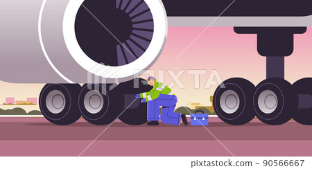 aviation worker mechanic in signal vest engineer repairing aircraft landing gear wheel professional airport staff 90566667