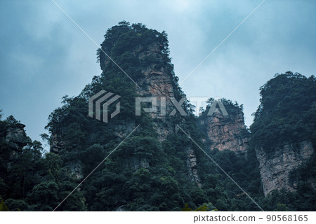 Amazing landscape of mountain and forest in the foggy at Wulingyuan, Hunan, China. Wulingyuan Scenic and Historic Interest Area which was designated a UNESCO World Heritage Site in China Amazing landscape of mountain and forest in the foggy at Wulingyuan, Hunan, China. Wulingyuan Scenic and Historic Interest Area which was designated a UNESCO World Heritage Site in China 90568165