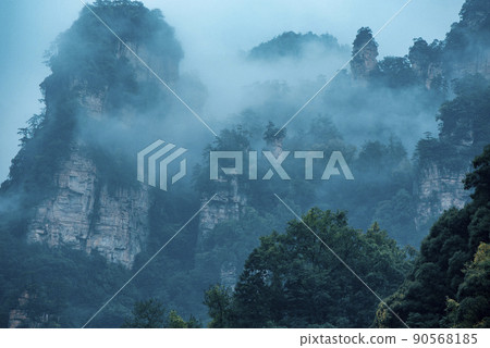 Amazing landscape of mountain and forest in the foggy at Wulingyuan, Hunan, China. Wulingyuan Scenic and Historic Interest Area which was designated a UNESCO World Heritage Site in China Amazing landscape of mountain and forest in the foggy at Wulingyuan, Hunan, China. Wulingyuan Scenic and Historic Interest Area which was designated a UNESCO World Heritage Site in China 90568185