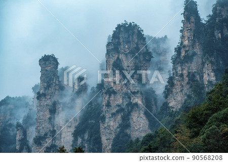 Amazing landscape of mountain and forest in the foggy at Wulingyuan, Hunan, China. Wulingyuan Scenic and Historic Interest Area which was designated a UNESCO World Heritage Site in China Amazing landscape of mountain and forest in the foggy at Wulingyuan, Hunan, China. Wulingyuan Scenic and Historic Interest Area which was designated a UNESCO World Heritage Site in China 90568208