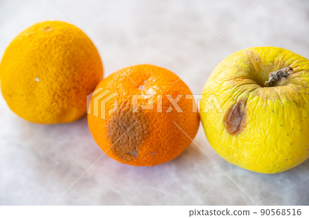 Rotten yellow fruit 90568516