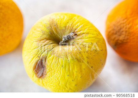 Rotten yellow fruit 90568518