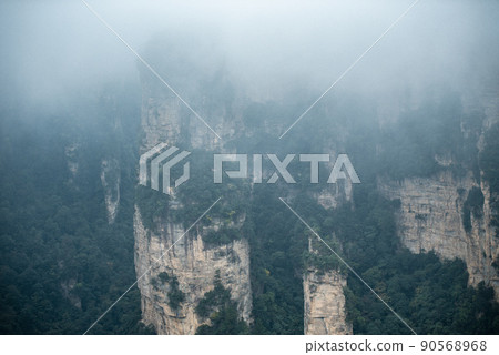 Amazing landscape of mountain and forest in the foggy at Wulingyuan, Hunan, China. Wulingyuan Scenic and Historic Interest Area which was designated a UNESCO World Heritage Site in China Amazing landscape of mountain and forest in the foggy at Wulingyuan, Hunan, China. Wulingyuan Scenic and Historic Interest Area which was designated a UNESCO World Heritage Site in China 90568968