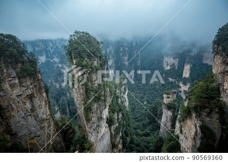 Amazing landscape of mountain and forest in the foggy at Wulingyuan, Hunan, China. Wulingyuan Scenic and Historic Interest Area which was designated a UNESCO World Heritage Site in China 90569360