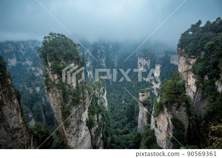 Amazing landscape of mountain and forest in the foggy at Wulingyuan, Hunan, China. Wulingyuan Scenic and Historic Interest Area which was designated a UNESCO World Heritage Site in China Amazing landscape of mountain and forest in the foggy at Wulingyuan, Hunan, China. Wulingyuan Scenic and Historic Interest Area which was designated a UNESCO World Heritage Site in China 90569361