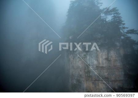 Amazing landscape of mountain and forest in the foggy at Wulingyuan, Hunan, China. Wulingyuan Scenic and Historic Interest Area which was designated a UNESCO World Heritage Site in China 90569397