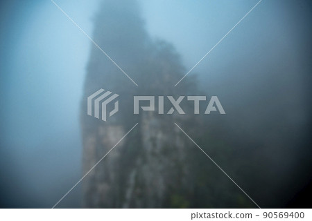 Amazing landscape of mountain and forest in the foggy at Wulingyuan, Hunan, China. Wulingyuan Scenic and Historic Interest Area which was designated a UNESCO World Heritage Site in China 90569400