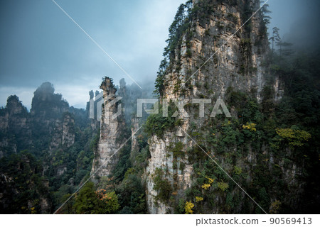 Amazing landscape of mountain and forest in the foggy at Wulingyuan, Hunan, China. Wulingyuan Scenic and Historic Interest Area which was designated a UNESCO World Heritage Site in China Amazing landscape of mountain and forest in the foggy at Wulingyuan, Hunan, China. Wulingyuan Scenic and Historic Interest Area which was designated a UNESCO World Heritage Site in China 90569413