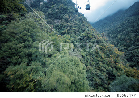 Amazing landscape of mountain and forest in the foggy at Wulingyuan, Hunan, China. Wulingyuan Scenic and Historic Interest Area which was designated a UNESCO World Heritage Site in China Amazing landscape of mountain and forest in the foggy at Wulingyuan, Hunan, China. Wulingyuan Scenic and Historic Interest Area which was designated a UNESCO World Heritage Site in China 90569477