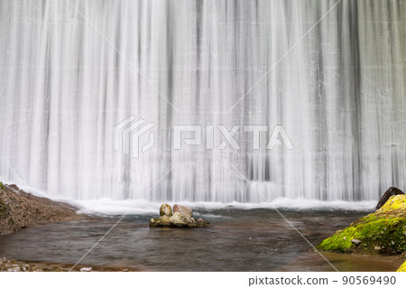 Beautiful fresh green and waterfall scenery with beautiful early summer blue autumn leaves flowing in the clear stream 90569490