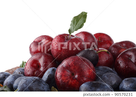 Blue and red plums background 90570231