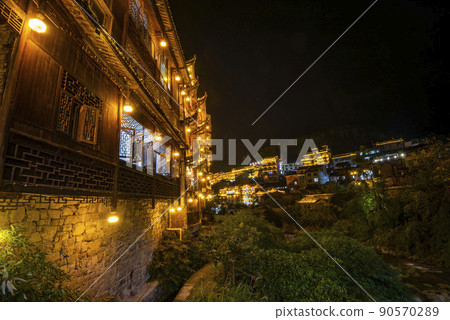 Furong Ancient Town illuminated at night. Amazing beautiful landscape scene of Furong Ancient Town (Furong Zhen, Hibiscus Town), China 90570289