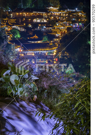 Furong Ancient Town illuminated at night. Amazing beautiful landscape scene of Furong Ancient Town (Furong Zhen, Hibiscus Town), China 90570299