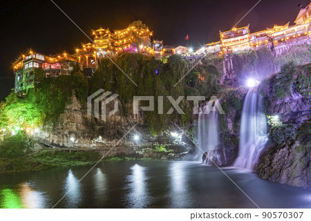 Furong Ancient Town illuminated at night. Amazing beautiful landscape scene of Furong Ancient Town (Furong Zhen, Hibiscus Town), China 90570307
