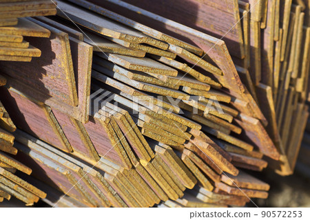 Metal profile strip in packs at the warehouse of metal products 90572253