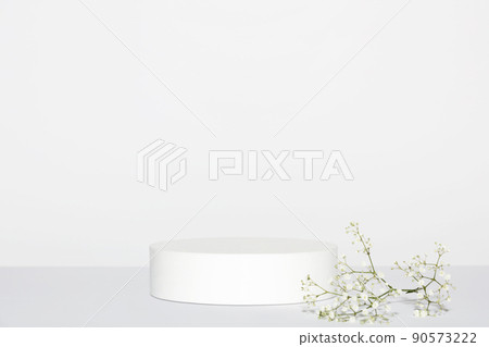 Abstract empty white podium and white flowers on grey background. Mock up stand for product presentation. 3D Render. Minimal concept. Abstract empty white podium and white flowers on grey background. Mock up stand for product presentation. 3D Render. Minimal concept. 90573222