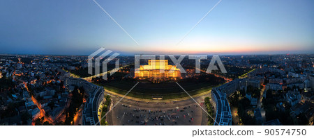 Aerial drone panoramic view of Palace of the Parliament in Bucharest downtown at night, Romania 90574750