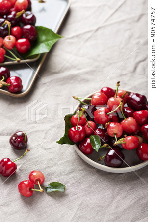 Fresh sweet cherry with green leaves 90574757
