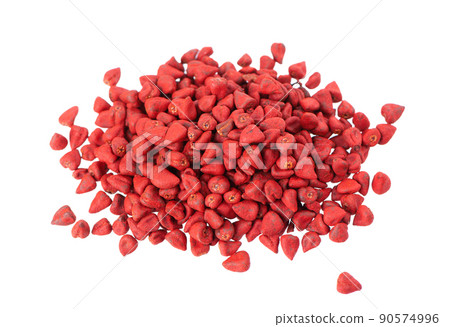 Annatto seeds, isolated on a white background. Achiote seeds, bixa orellana. Natural dye for cooking and food. Close-up. Top view. 90574996