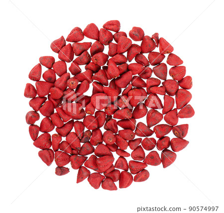 Annatto seeds, isolated on a white background. Achiote seeds, bixa orellana. Natural dye for cooking and food. Close-up. Top view. 90574997