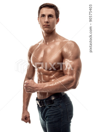 Muscular handsome young man with naked torso. Isolated on white background. 90575403