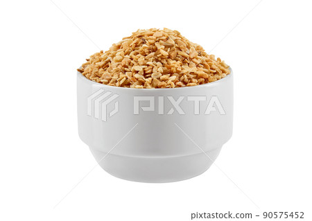 Chopped garlic in a bowl isolated on white background with copy space for text or images. Spices and herbs. Packaging concept. Close-up. Chopped garlic in a bowl isolated on white background with copy space for text or images. Spices and herbs. Packaging concept. Close-up. 90575452
