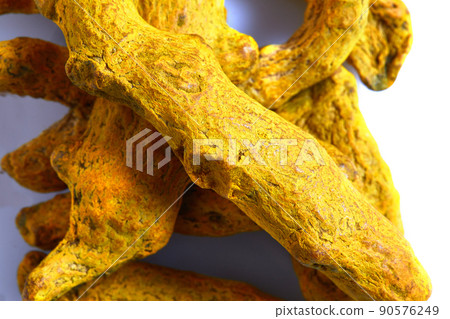 Dry Turmeric roots or barks isolated on white background. Close-up Dry Turmeric roots or barks isolated on white background. Close-up 90576249