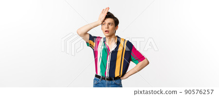 Tired queer man facepalm and sighing distressed, standing against white background troubled 90576257
