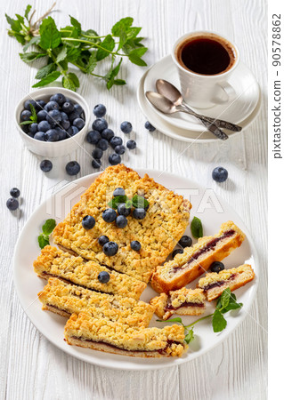 sliced blueberry crumble pie on plate, top view sliced blueberry crumble pie on plate, top view 90578862