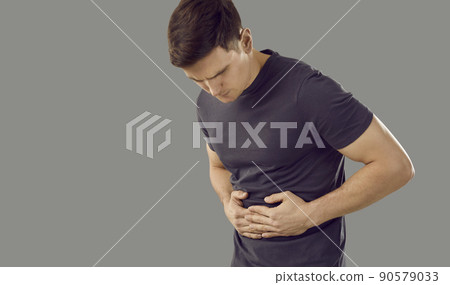Unwell man having spasm or pain in abdomen Unwell man having spasm or pain in abdomen 90579033