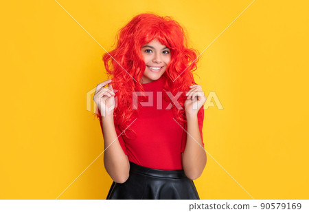 happy child with red long hair on yellow background happy child with red long hair on yellow background 90579169