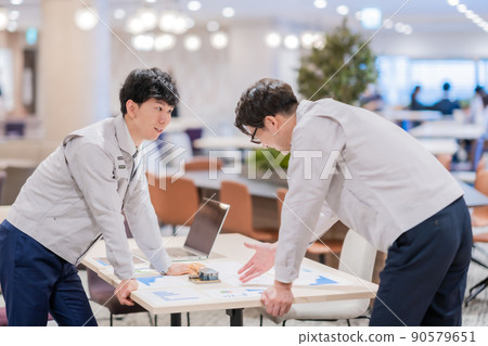 Engineers discussing construction plans Engineers discussing construction plans 90579651
