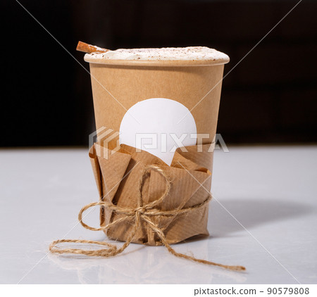 Biodegradable Disposable Cup with blank white circle for text containing a hot drink with copy space. Biodegradable Disposable Cup with blank white circle for text containing a hot drink with copy space. 90579808