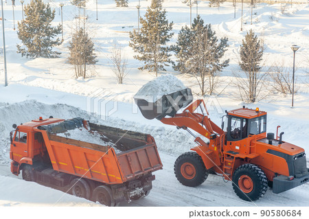 Cleaning and cleaning of roads in the city from snow in winter 90580684