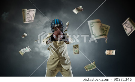 Businessman acting as american football players Businessman acting as american football players 90581346