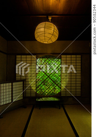 Fresh green seen from the circular window of Giouji Temple 90582344