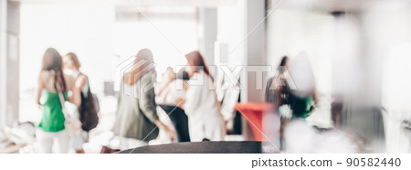 Blured image of businesspeople at coffee break at conference meeting. Blured image of businesspeople at coffee break at conference meeting. 90582440