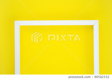 the white frame is a different letter, highlighting the center on a bright yellow background. High quality photo the white frame is a different letter, highlighting the center on a bright yellow background. High quality photo 90582532