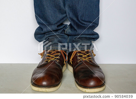 Wearing work boots and denim 90584039