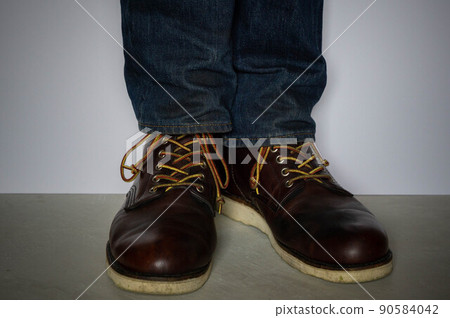 Wearing work boots and denim Wearing work boots and denim 90584042