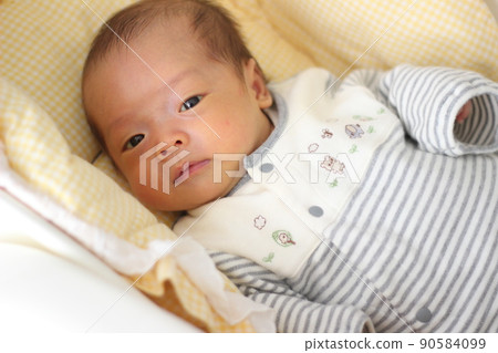 1 month old baby staring at the mother's face 1 month old baby staring at the mother's face 90584099