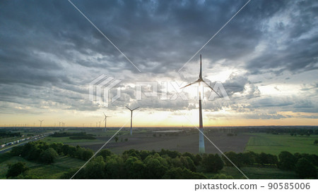 Panoramic aerial drone view of wind farm or wind park, with high wind turbines for generation Panoramic aerial drone view of wind farm or wind park, with high wind turbines for generation 90585006