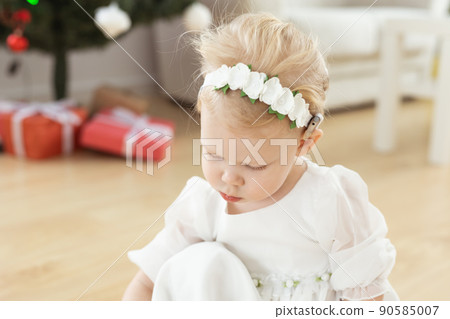 Child girl with cochlear implant plays at home. Hear impairment and diversity and hearing aid copy space and place for advertising Child girl with cochlear implant plays at home. Hear impairment and diversity and hearing aid copy space and place for advertising 90585007