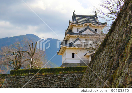 Uwajima Castle Ruins, a historic site in Uwajima City, Ehime Prefecture, overlooking the castle tower over the stone wall 90585870