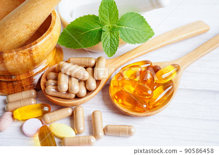 Alternative medicine herbal organic capsule with vitamin E omega 3 fish oil, mineral, drug with herbs leaf natural supplements for healthy good life. 90586458