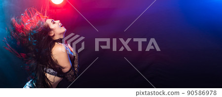 Banner woman belly dancer in exotic dress with gold, dancing tribal fusion dance in studio with copy space Banner woman belly dancer in exotic dress with gold, dancing tribal fusion dance in studio with copy space 90586978