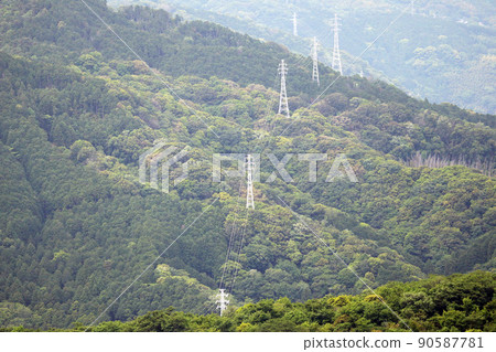 Steel towers and power lines built in the mountains 90587781